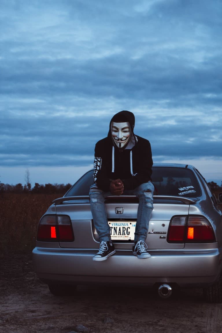sitting on the trunk of an accord