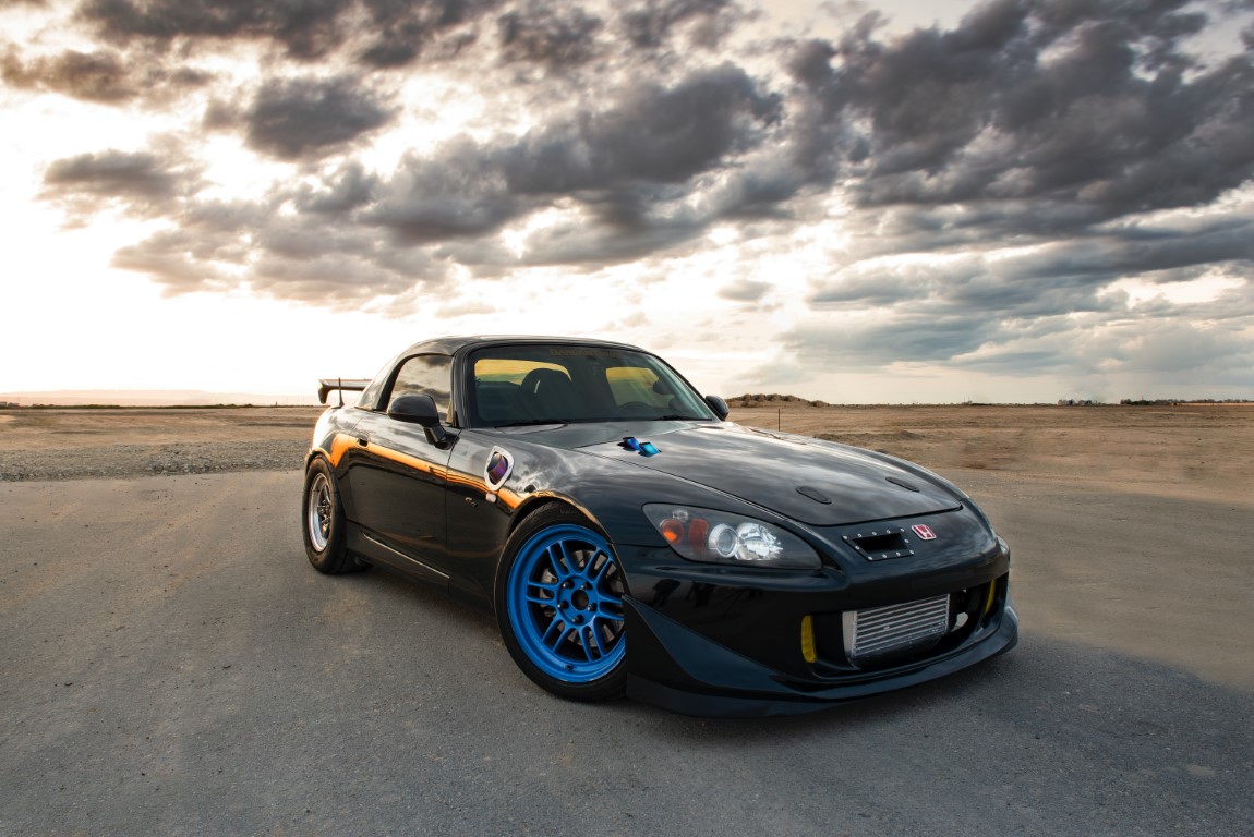 nice s2000 on the road in front of clouds