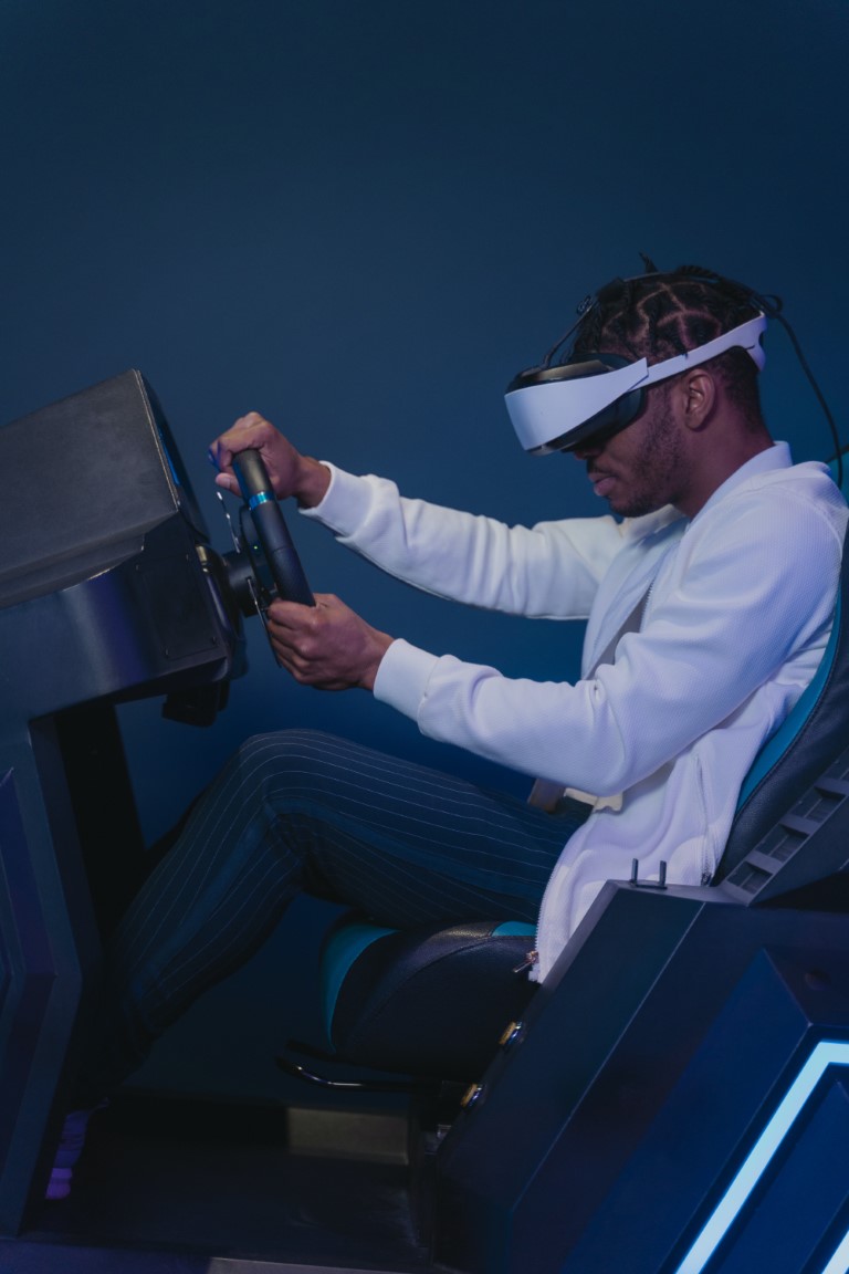 person using a vr headset to race