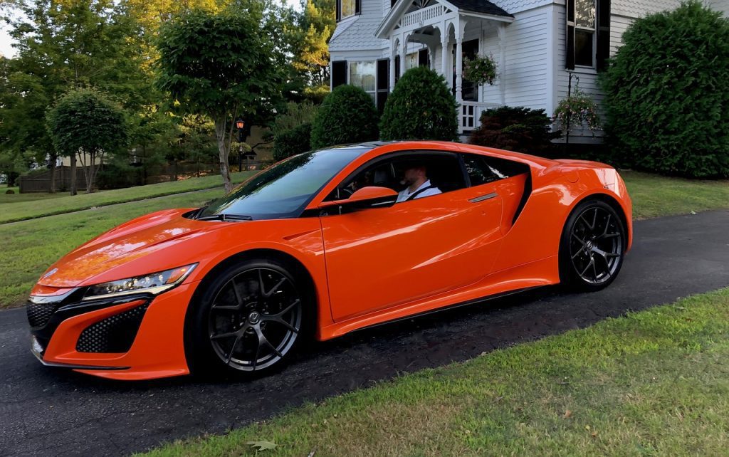 newer acura nsx in a driveway