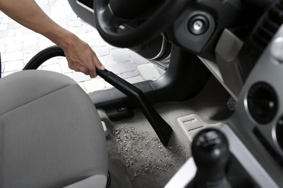 vacuuming the entire interior of your car to get rid of any dirt