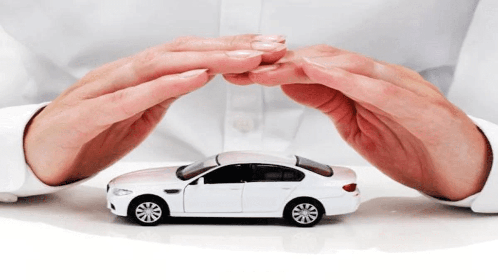 hands hovering over a white model car