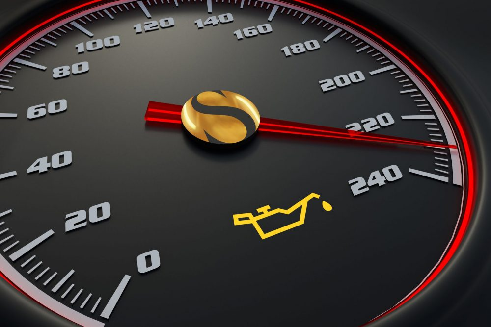 cars speedometer with check oil light on