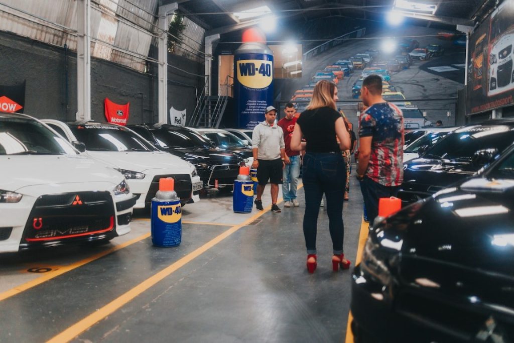 cars parked around cans of wd 40