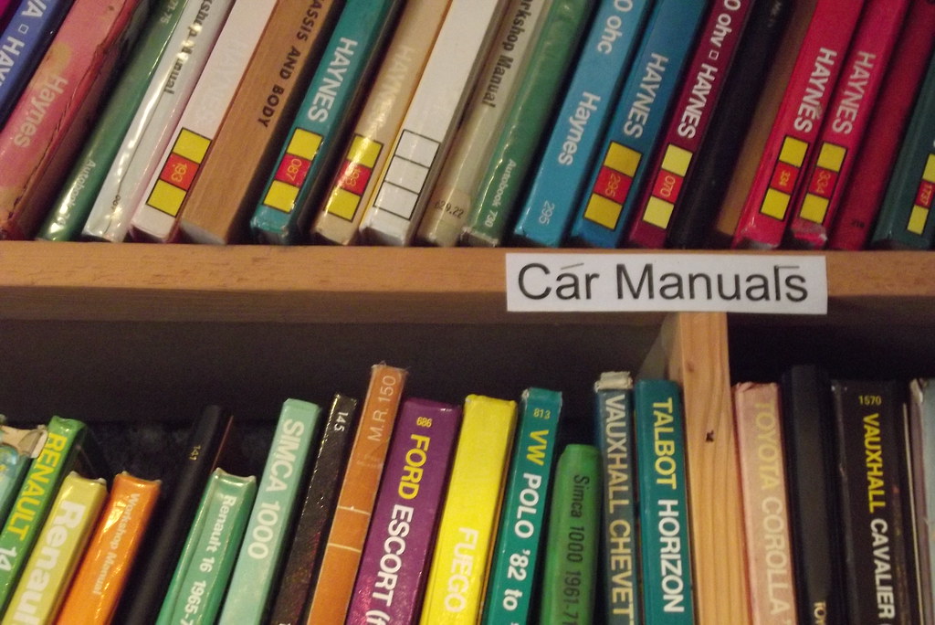 car manuals on a shelf