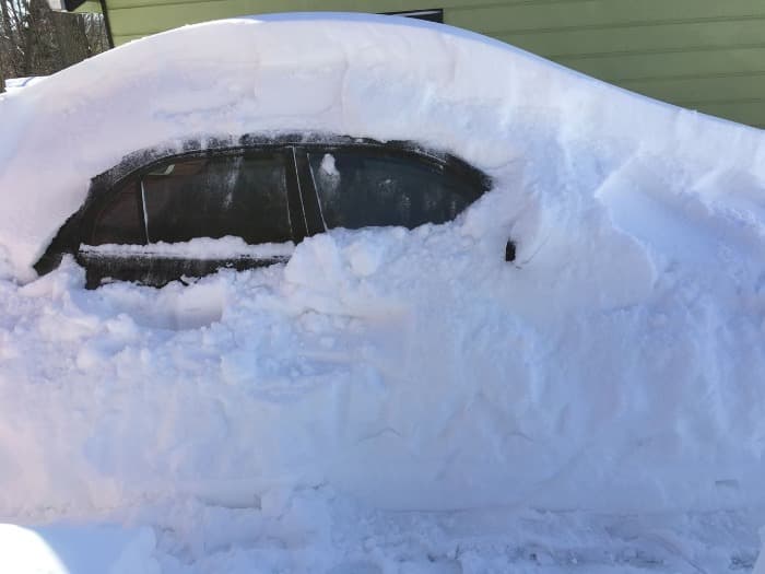 Car under a heavy snowfall