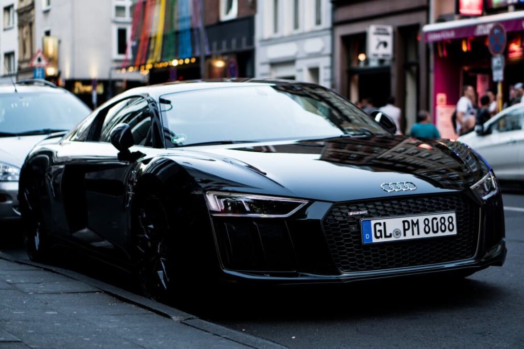 Black audi r8 on the road