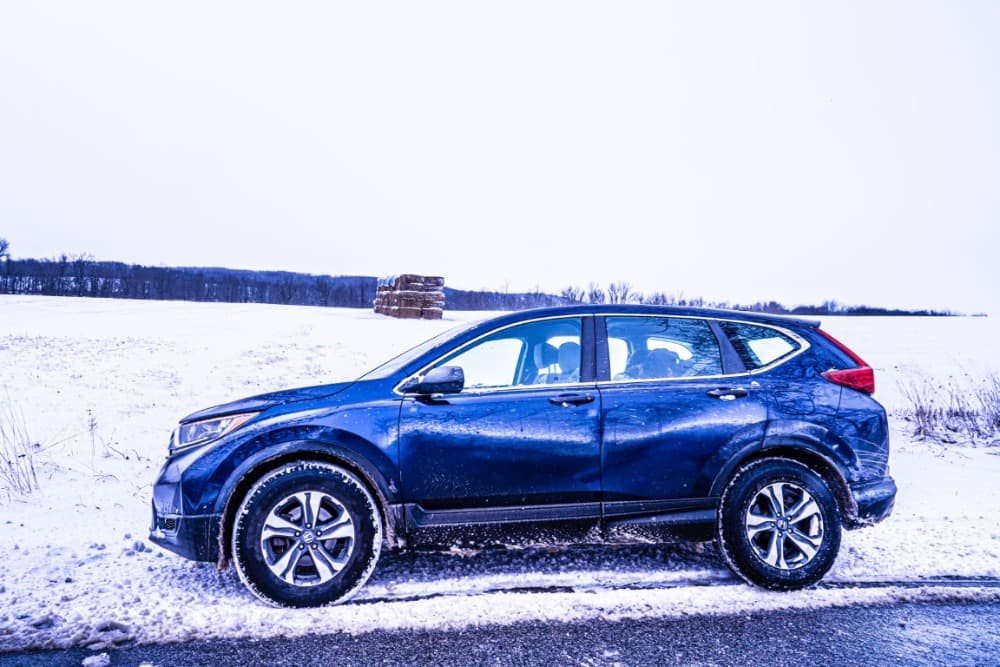 blue honda crv outside in the snow