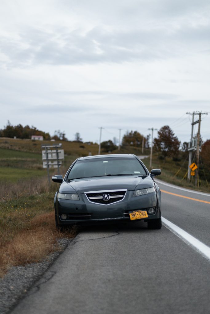 acura tl parked on the side of the road