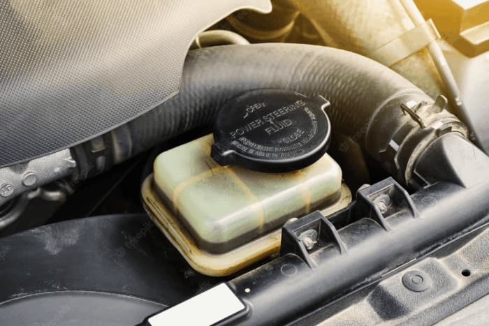 Power steering fluid reservoir