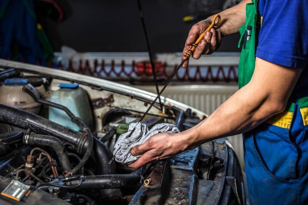 car maintenance checking the oil