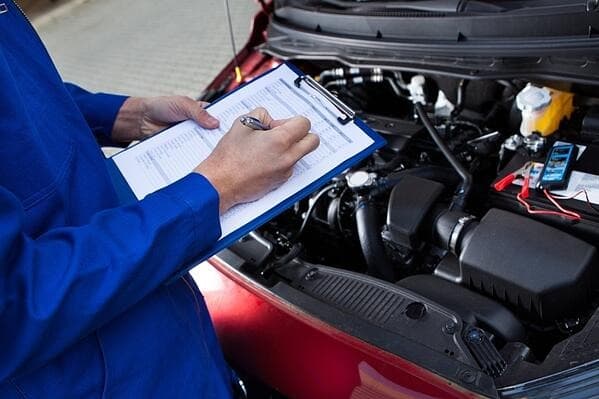 someone making a List of car maintenance costs