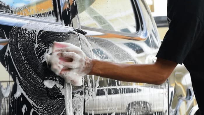 Someone is car washing with a soap