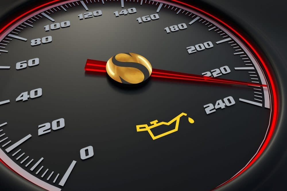 cars speedometer with check oil light on