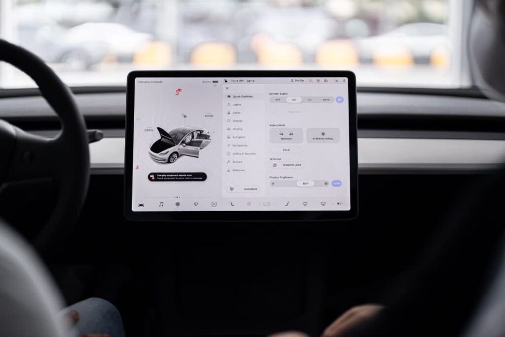tesla interior with an ipad looking controller setup