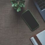 iPhone beside macbook
