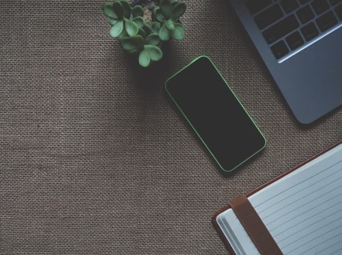 iPhone beside macbook