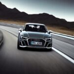 grey audi driving on a highway