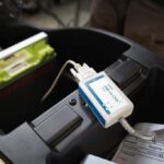 white and blue charger adapter