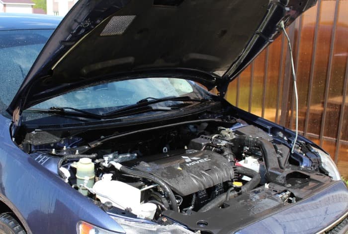 popping a hood on a Mitsubishi car