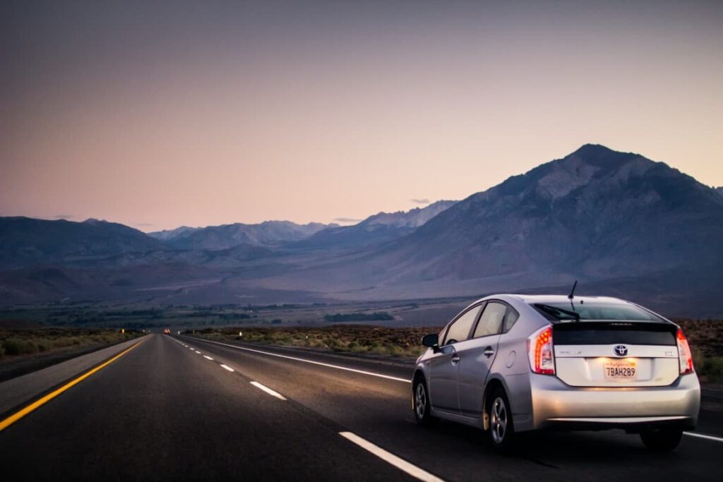 toyota prius driving on a highway