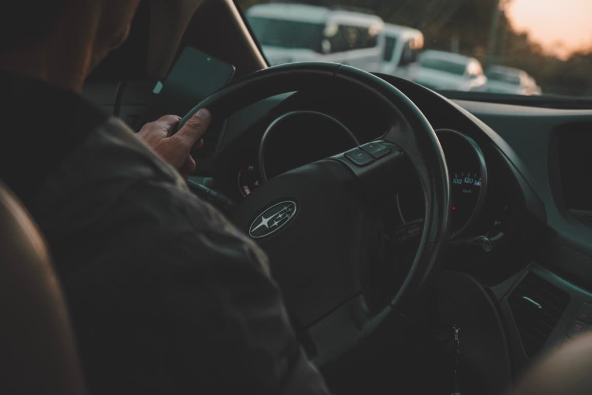person driving a subaru